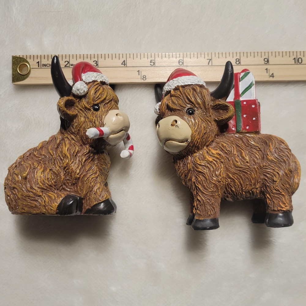 Highland Cow Christmas Figurine Set of 2 - Resin Santa Hat Candy Cane & Gift Box